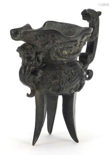 Chinese patinated bronze tripod wine vessel with animalia ha...