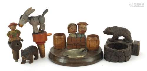 Black Forest carvings including a bear ashtray and mechanica...