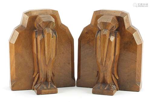 Pair of Art Deco walnut bookends carved with stylised pelica...