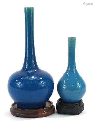 Two Chinese porcelain long neck bottle vases having blue gla...