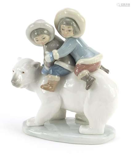 Lladro figure group of young Eskimos on a polar bear, 17cm h...