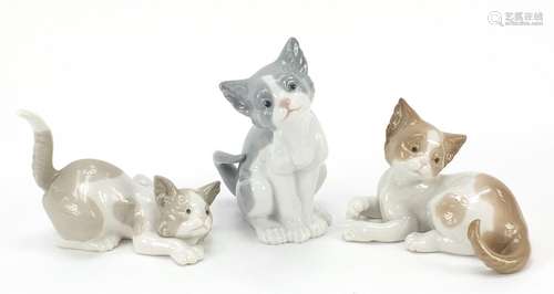 Three Lladro cats, the largest 14cm high