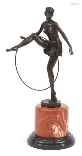 Large patinated bronze figurine of an Art Deco dancer raised...