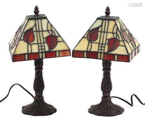 Pair of Tiffany design bronzed table lamps with leaded glass...