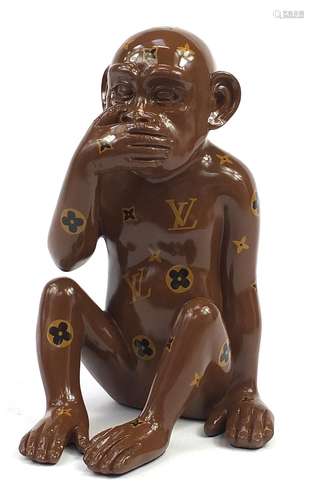 Louis Vuitton style seated chimpanzee, 38cm high