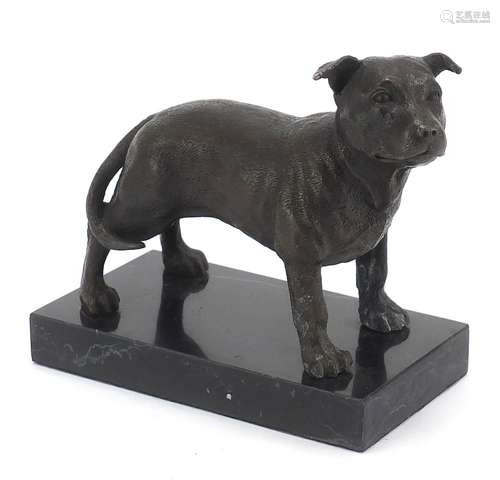 Patinated bronze Pitbull Terrier raised on a black marbleise...