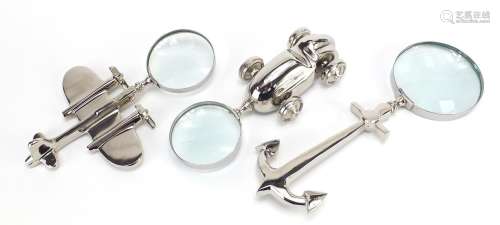 Three novelty silver plated magnifying glasses in the form o...