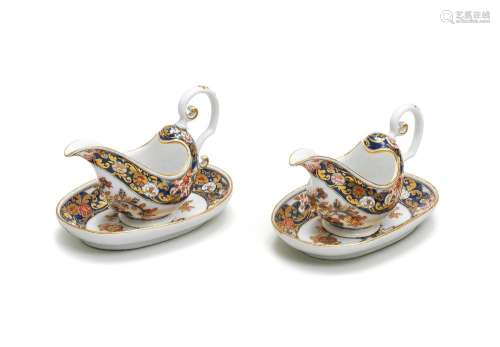 A very rare pair of Meissen Imari sauceboats and oval stands...