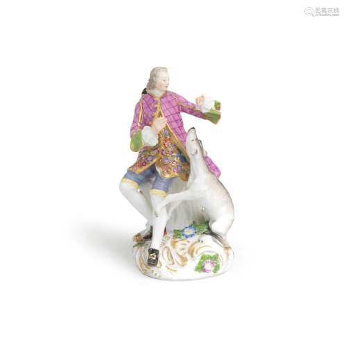 A Meissen later-decorated figure of a gentleman with a hound...