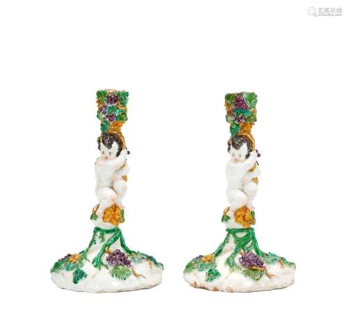 【*】A pair of Capodimonte or Buen Retiro candlesticks, circa ...