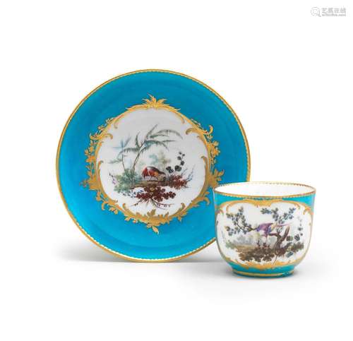 A Sèvres bleu-céleste ground cup and saucer (gobelet 'bouill...