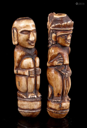 2 carved bone figures