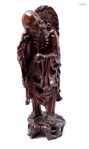 Wooden statue of a sage