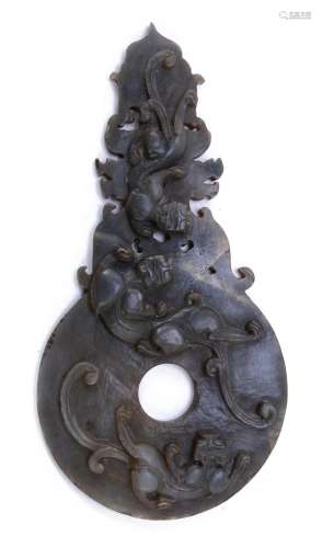 A JADE SCULPTURE IN THE SHAPE OF A BI DISC WITH CLIMBING CHI...