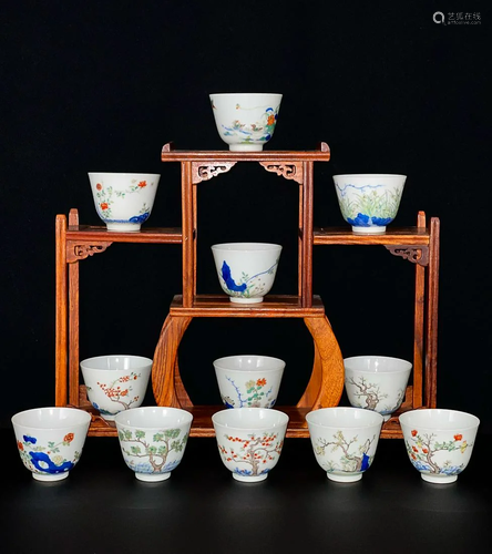 TWELVE CHINESE BLUE-AND-WHITE AND DOUCAI CUPS DEPICTING ...