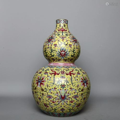 CHINESE YELLOW-GROUND FAMILLE-ROSE DOUBLE-GOURD VASE DEPICTI...