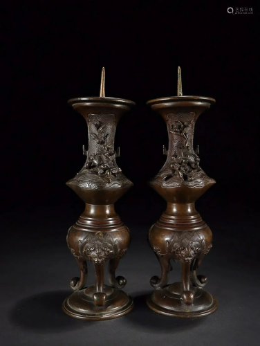TWO CHINESE BRONZE CANDLE HOLDERS ON LION-LEGS