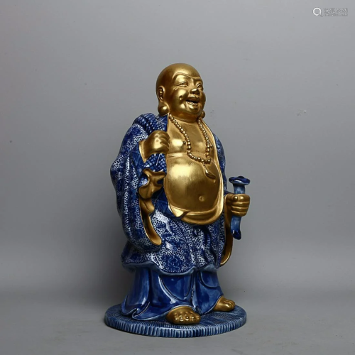 CHINESE GILDED ON BLUE-AND-WHITE FIGURE OF MAITREYA
