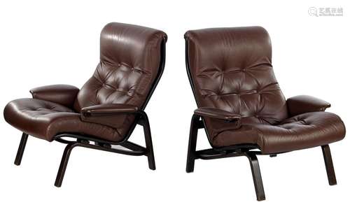 2 brown padded leather armchairs