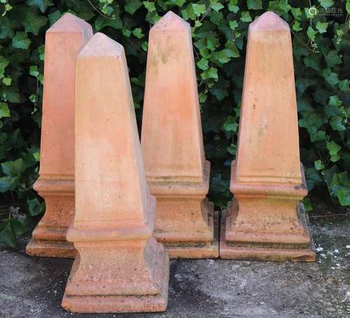 4 terracotta obelisk ornaments