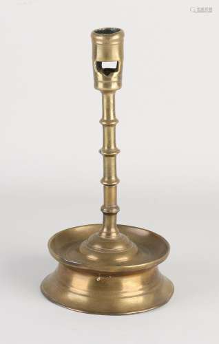 17th century skirt candlestick, H 23 cm.