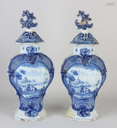 Two 18th century Delft vases with lids, H 36 cm.