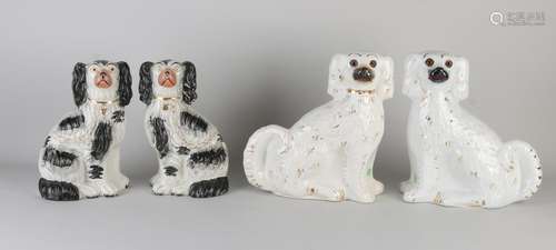 Four antique English Staffordshire dogs