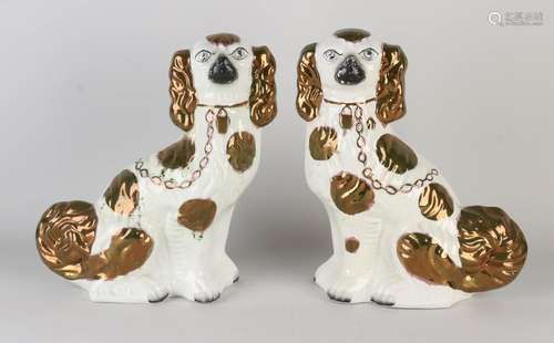 Two antique English Staffordshire dogs