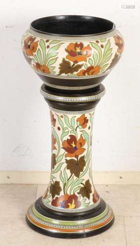 Antique flower pot on a column