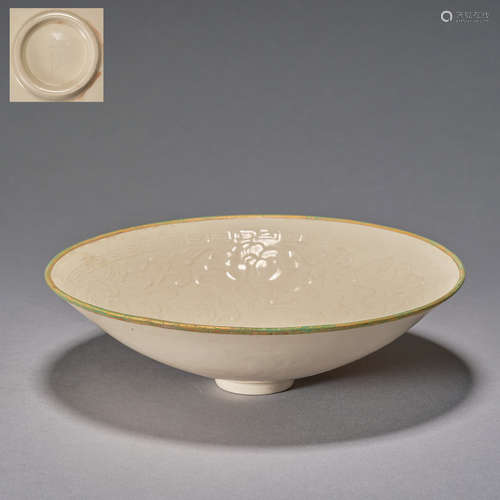 A carved Dingyao 'floral' bowl, Song dynasty