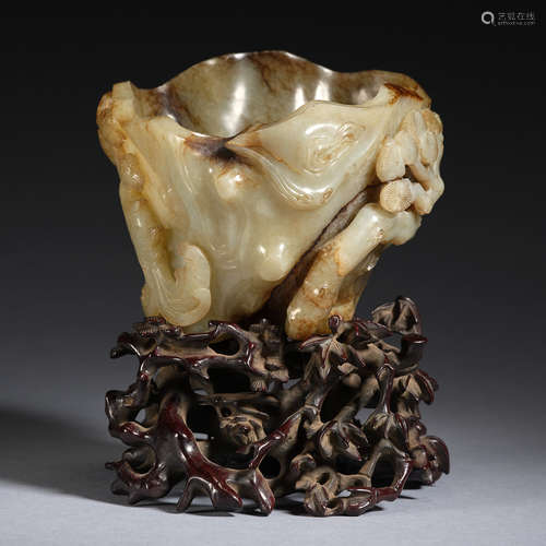 A jade 'phoenix in pine forest' cup with wood stand,Qing dyn...