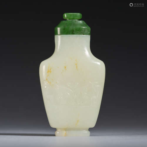 A white jade 'auspicious beast' snuff bottle with a spinach-...