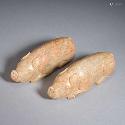 A pair of jade ‘pig’ paperweights , Warring States