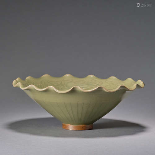 A carved Yaozhou celadon 'floral' conical bowl, Song dynasty