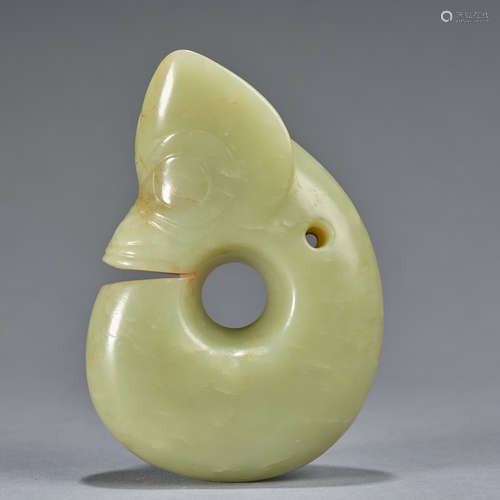 An important celadon and russet jade 'pig-dragon', zhulong N...