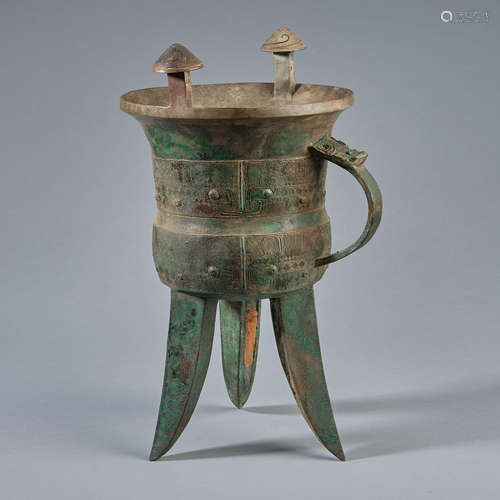 An ancient bronze libation cup (jue)