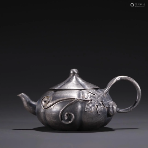 A Delicate Silver Teapot