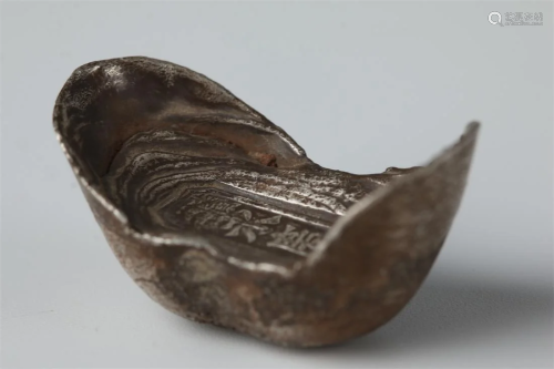 A SILVER INGOT, WITH LETTERING "YONGQING".
