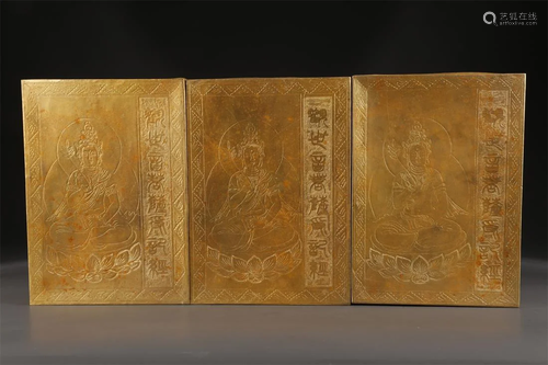 A SET OF GILT BRONZE SUTRAS.