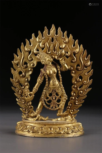 A TIBETAN GILT BRONZE NARO KHECHARI STATUE.