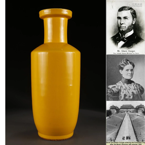 A YELLOW GLAZED MALLET-SHAPED PORCELAIN BOTTLE.