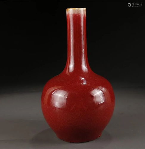 A RUBY GLAZED LONG-NECK PORCELAIN BOTTLE.