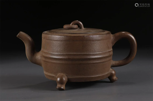 A PURPLE CLAY TRIPOD TEAPOT.