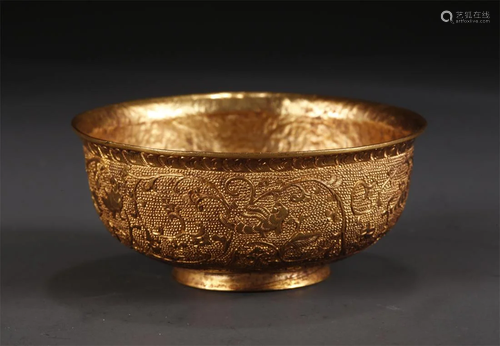 A GILT BRONZE CUP WITH TWINING FLOWERS DESIGN.