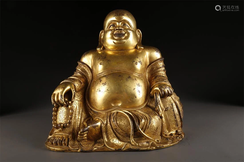 A GILT BRONZE MAITREYA BUDDHA STATUE.