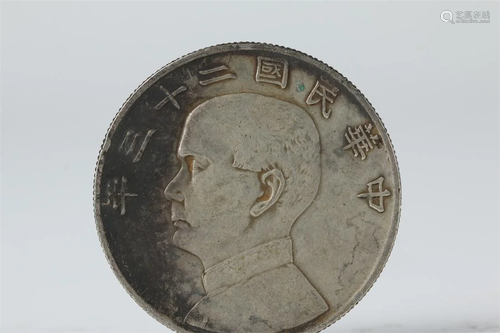 AN ONE-YUAN SILVER COIN.