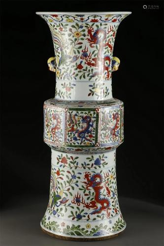 A PORCELAIN VESSEL "HUAGU" WITH DRAGON DESIGN.