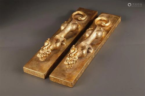 A PAIR OF GILT BRONZE PAPERWEIGHTS.