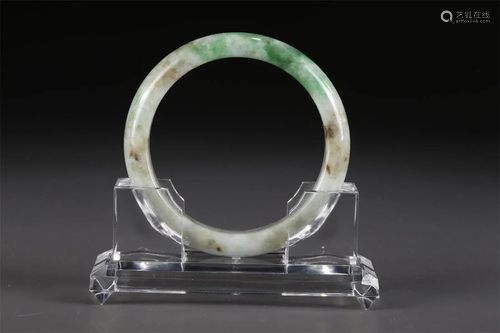 A JADEITE BANGLE.