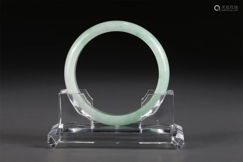 A JADEITE BANGLE.